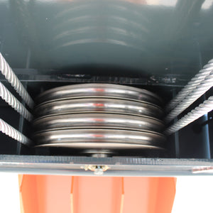 Stack of four steel cable sheaves with lifting cables routed around them