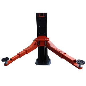 Two-post lift swing arms extended low with screw-up rubber contact pads