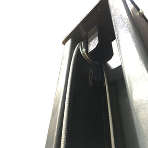 Steel equalizer cable routed over the sheave at the top of the column