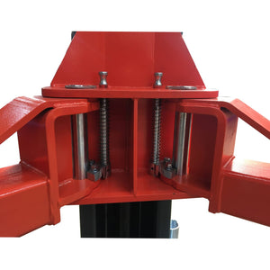 Close-up of the spring-loaded arm restraint locks on the lift carriage