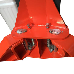 Overhead view of the carriage arm-lock springs and arm pivot pins