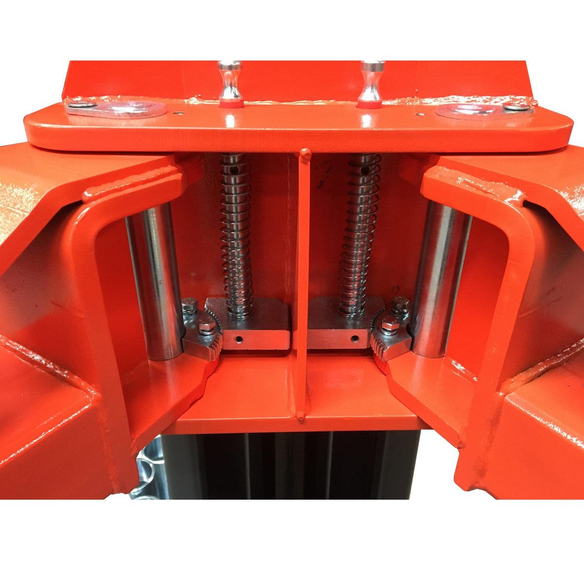 Spring-loaded arm-restraint gears and chrome arm pivot pins on the carriage