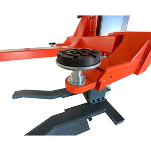 Screw-up adjustable rubber lift pad extended on its threaded riser on the orange arm