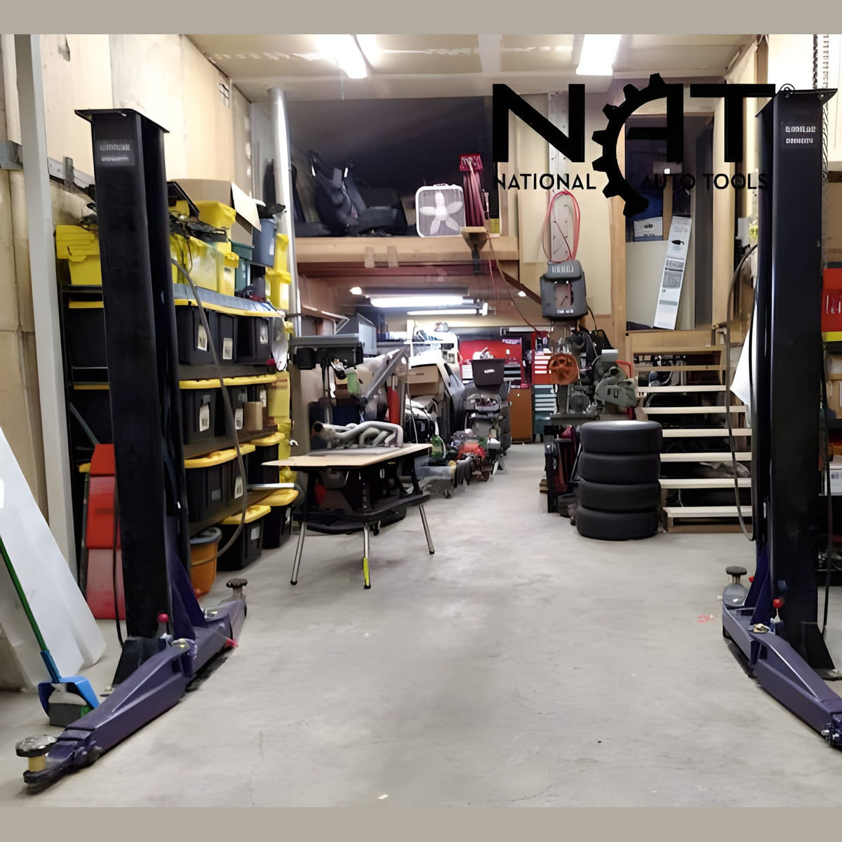 Pair of Triumph C7000 portable two-post lifts installed in a working auto shop