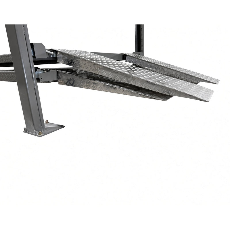 Aluminum checker-plate ramps at the elevated runway edge