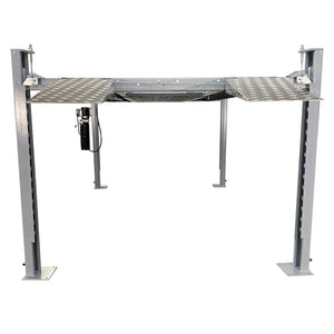 Triumph NSS-8 X1 four-post lift raised showing column locking ladder and hydraulic power unit