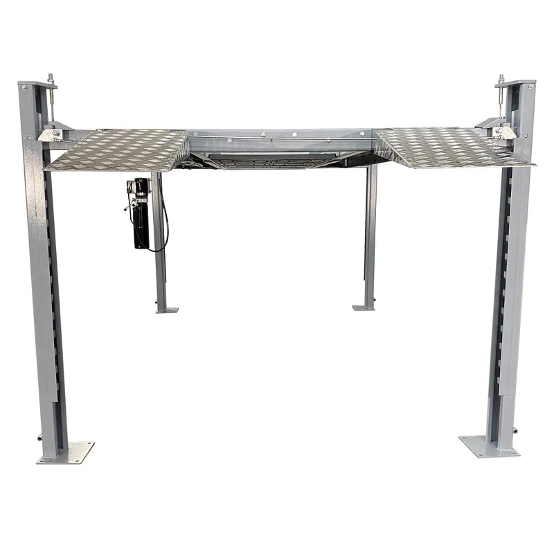 Triumph NSS-8 X1 four-post lift raised showing column locking ladder and hydraulic power unit
