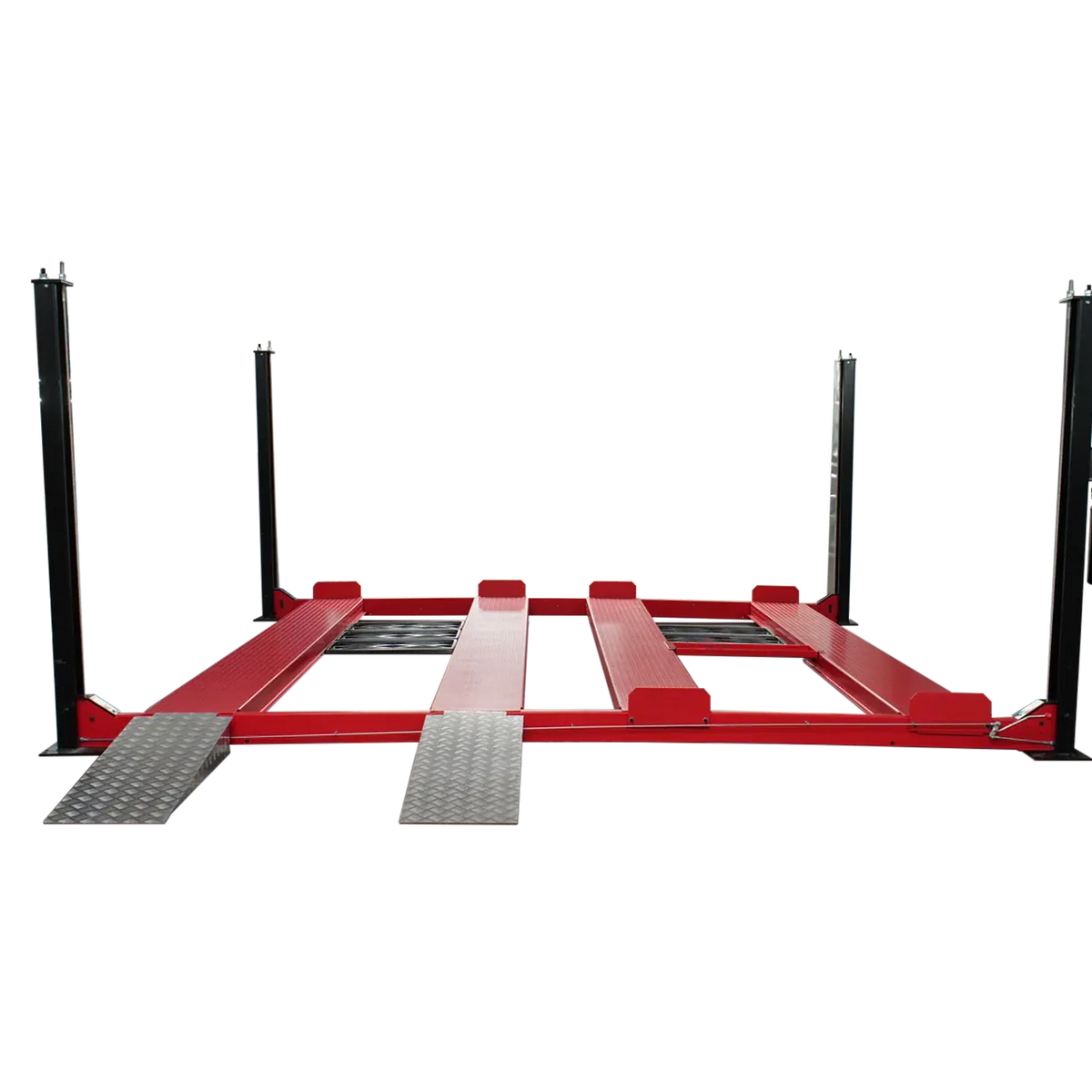Triumph NSS9000 four-post lift deck lowered, two side-by-side runway lanes, drive-on ramps and side-mounted power unit
