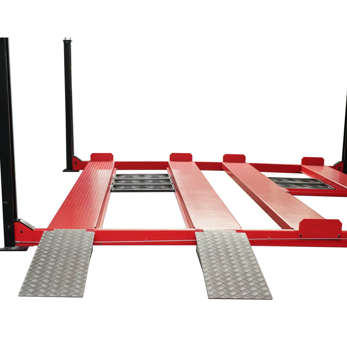 Close-up of two silver drive-on approach ramps and center roller slide rails between red runways