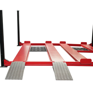 Close-up of two silver drive-on approach ramps and center roller slide rails between red runways
