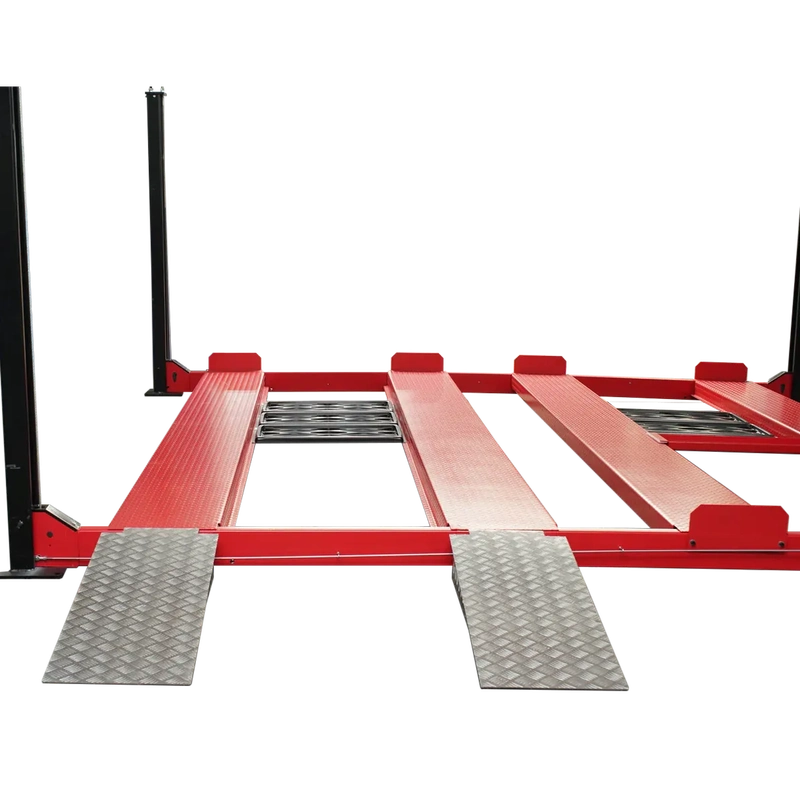 Close-up of two silver drive-on approach ramps and center roller slide rails between red runways