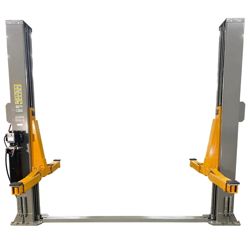 Triumph NT-16 two-post lift front view with arms folded inward and floor-plate connecting bar at the base
