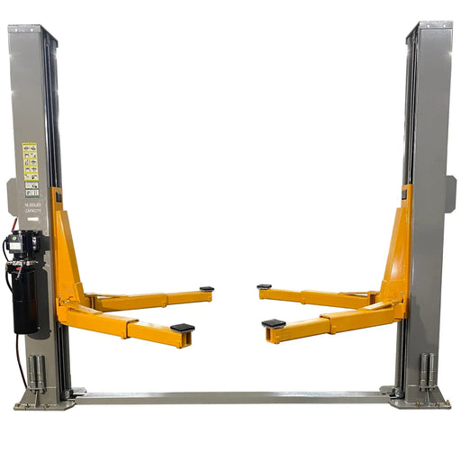 Triumph NT-16 floor-plate two-post auto lift, front view with 16,000 lb capacity label on column