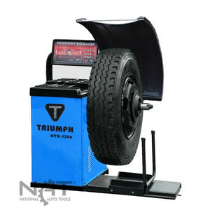 Triumph NTB-1200 electronic wheel balancer with truck wheel mounted, front view