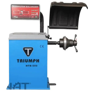 Triumph NTB-550 computer wheel balancer with safety hood, cone adapter, and CE mark