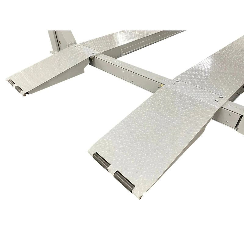 Triumph NTR-32 four-post lift approach ramp close-up showing hinge and rubber bumper detail