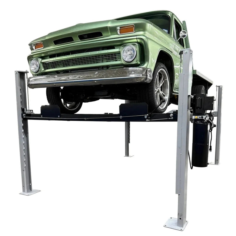 Triumph USA8000 four-post lift raised with a classic green Chevrolet pickup, front three-quarter view