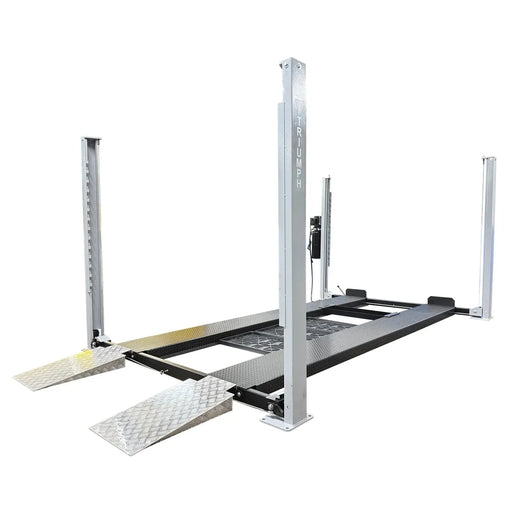 Triumph USA8000XLT 8,000 lb four-post lift, gray columns with Triumph branding, drive-on ramps and center drip-tray channel