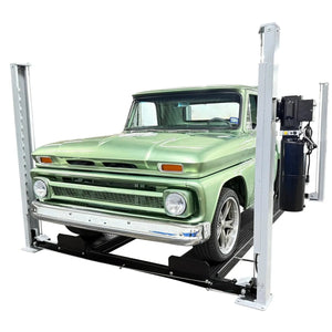 Front view of the USA8000XLT at low height with a green classic Chevrolet pickup on the runways